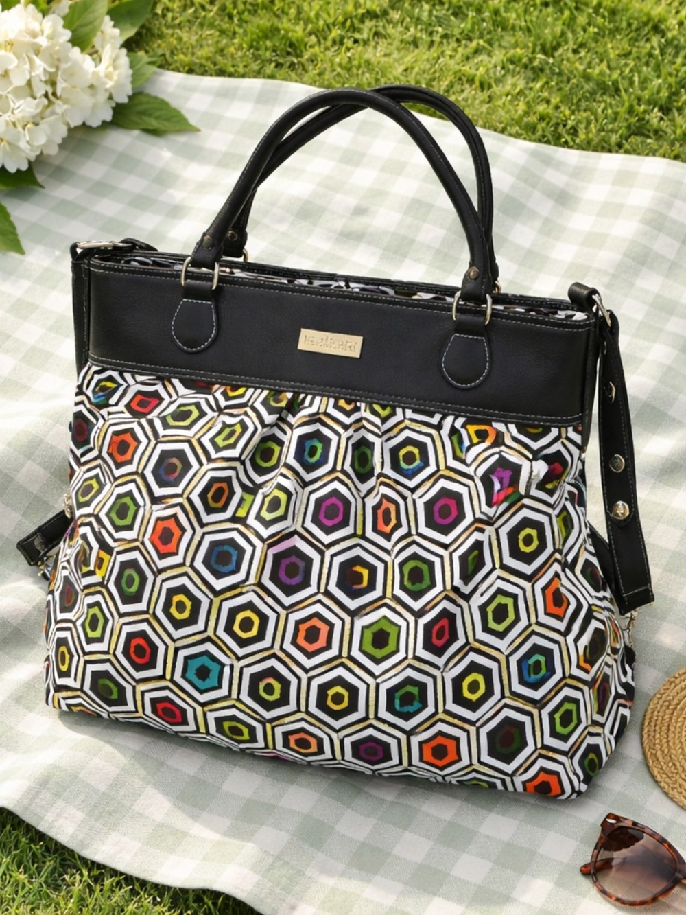 Hadaki HDK Tote Pod Bag  Leather Top, multicolored honeycomb patterned body.
